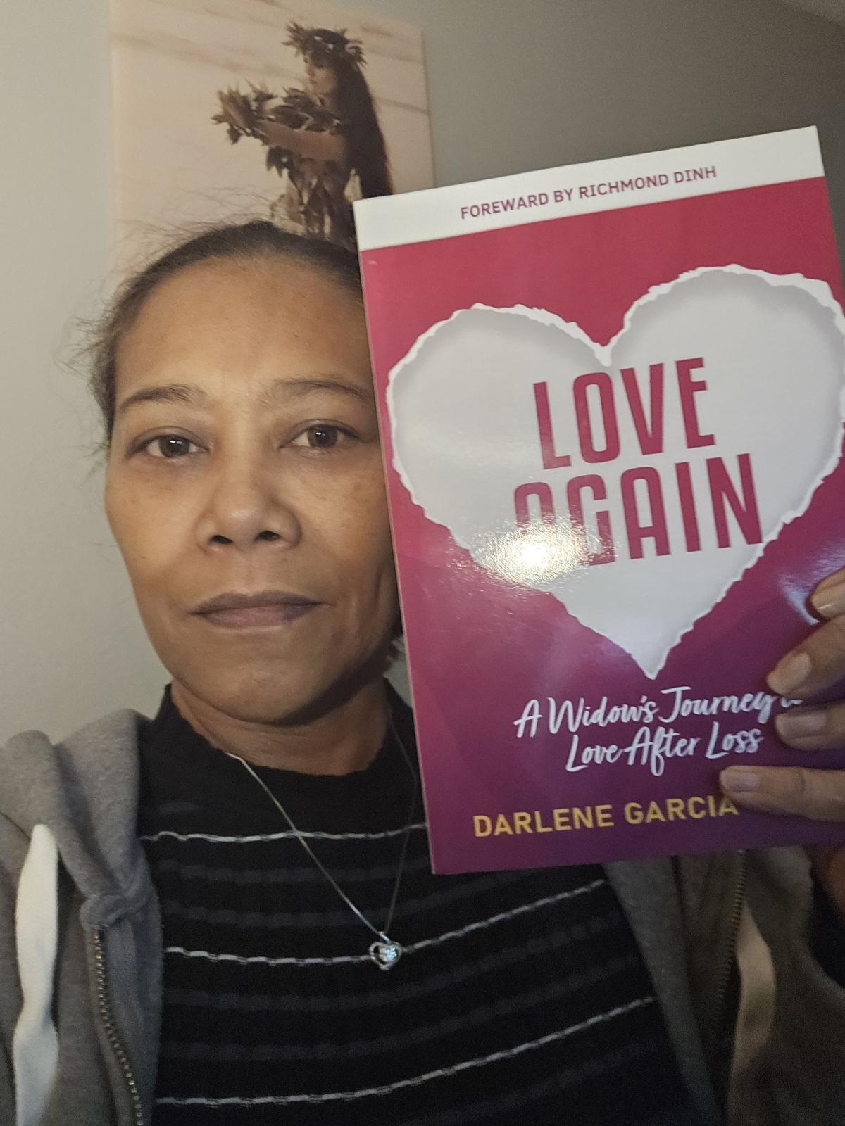 Widow holding Love Again book
